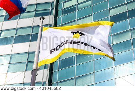 Samara, Russia - May 7, 2017: The Flag Of Oil Company Rosneft Against Office Building. Rosneft Is On