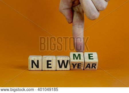 New Year Time. Male Hand Turns Cubes And Changes The Words 'new Year' To 'new Me'. Beautiful Orange 