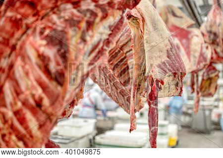 Chopped Beef Carcasses. Overhead Conveyor For Cow Carcasses, Meat Production.