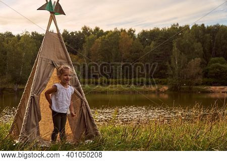 A Little Girl Lake And Nature. Sunny Akat. Wigwam. Happy Child.