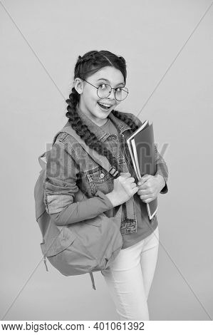 Got Homework Done. Playful Girl Hold School Bag And Books. Homework Assignment. Home Schooling. Home