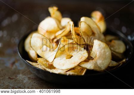 Close Up Of Rustic English Pub Grub Ribbon Cut Potato Crisps