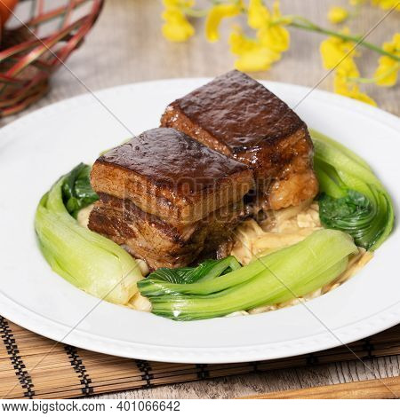 Dong Po Pork Meat In A Blue Plate With Broccoli With Red Background.