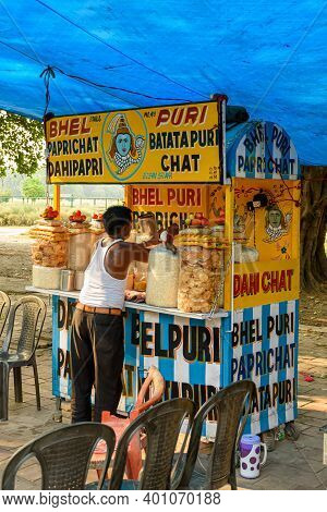 A Man Selling Papri Chat, Bhel Puri And Wide Variety Of Chats, In His Cart Beside A Road In Kolkata,