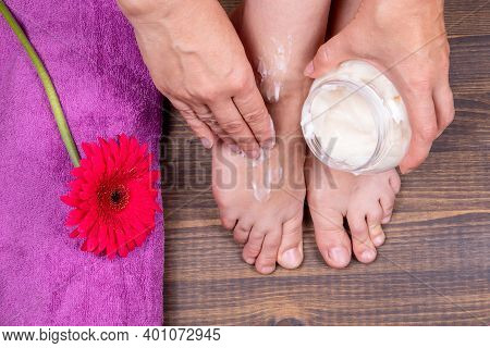 Putting Body Butter On Feet. Skin Care And Beauty Procedures For Legs And Feets