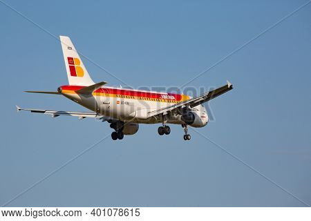 ZURICH - JULY 18: Airbus A-319 Iberia landing in Zurich after short haul flight on July 18, 2015 in Zurich, Switzerland. Zurich airport is home for Swiss Air and one of biggest european hubs.