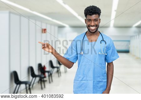 Handsome African American Male Nurse With Beard At Vaccination Station Is Ready For Vacinating Patie