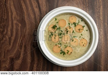 German Traditional Kartoffelsuppe Potato And Sausage Soup On Wood Table Background