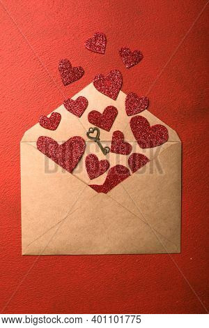 Paper Envelope With Valentines Hearts On Red Background. Flat Lay, Top View. Romantic Love Letter Fo