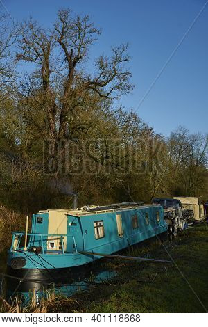 Bath, Somerset, United Kingdom - December 27, 2020: Narrowboats Illuminated By The Early Morning Win