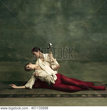 Death. Two Young Female Ballet Dancers Like Duelists With Swords On Dark Green Background. Caucasian