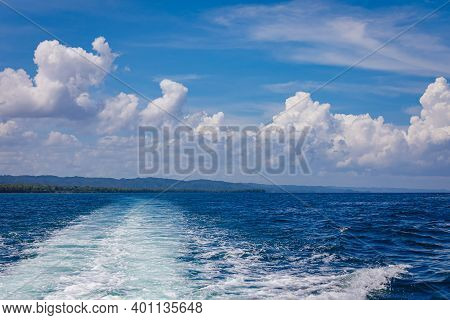 Stormy Foam Tracks From The Sea Boat, Diverge Far Into The Distance. The Motor Boat Pulled Away From