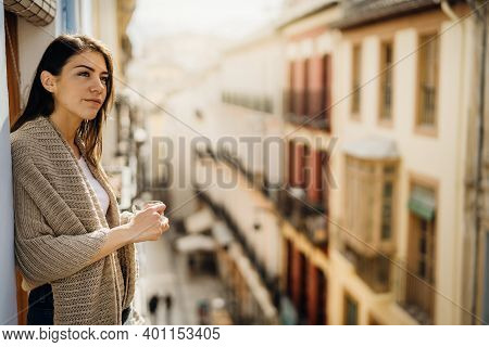 Young Woman Spending Free Time Home.self Care,staying Home.enjoying View From The Balcony.quarantine