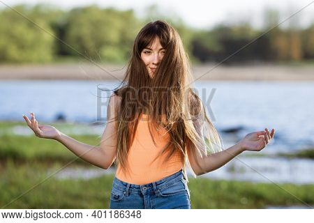 Happy Young Woman Dancing In Headphones On The Shore Of The Bay Sun Sunny Spring Day