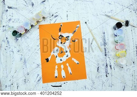 Drawn Horned Animal On Orange Background. Diy, Year Of The Ox Craft Activity For Kids. Symbol Of The