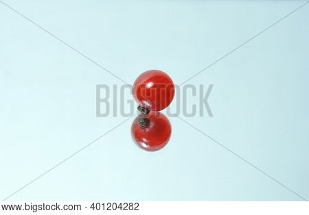 Single Red Currant Berry On A Mirror Surface , Minimalism