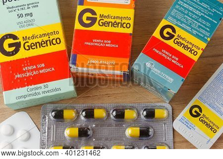 Rio De Janeiro, Brazil - September 5, 2020: Boxes Of Generic Medicine On Wooden Table. Generic Remed