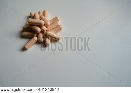 Peach Colored Veggie Capsules Of Probiotic Dietary Supplement