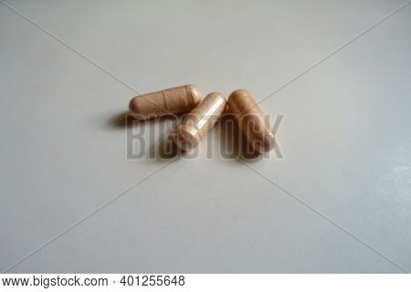 Peach Colored Capsules Of Probiotic Dietary Supplement (three Items)