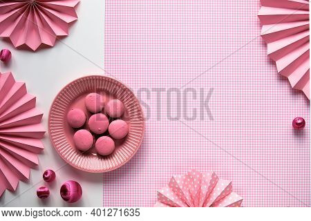 Creative Food Concept. Sweet And Tasty Macaroons On A Plate. Monochrome Flat Lay On Checkered Pink C