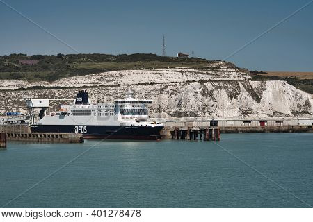 Dover, United Kingdom - July 31 2020: DFDS Ferries in port of Dover, UK with Dover Castle in the background