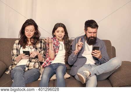 Smartphone Ruining Relations. Unhappy Child Complain Of Parents Addicted To Phones. Parents And Chil