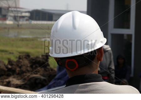 Bekasi, 7/12/2020. A Foreman Wearing A Security Helmet On A Housing Project In Bekasi, West Java, In