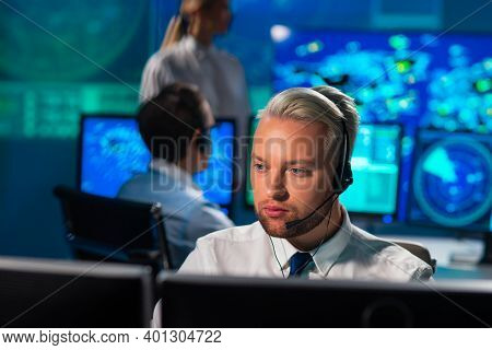 Workplace Of The Air Traffic Controllers In The Control Tower. Diverse Team Of Aircraft Control Offi