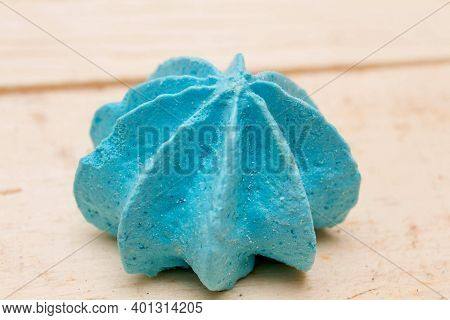 Blue, Sweet, Crispy Meringue Close-up On A Wooden Background.