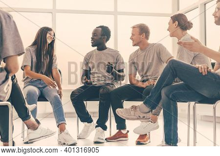 Group Of Young Like-minded People Discussing Their Ideas