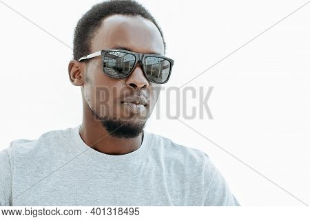 Stylish Guy With Dark Sunglasses. Isolated On White