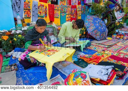 Kolkata, West Bengal, India - 31st December 2018 : Young Bengali Female And Male Artists Painting Pa