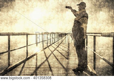 Man Traveler Looking At His Smartphone On The Background Of Sea From Sea Bridge. Calotype Filter. Ol