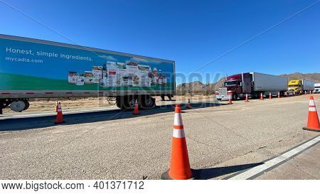 Texas Usa - February 24,2020:  A Line Of Trucks Waiting At A Usa Border Patrol Checkpoint To Be Ques
