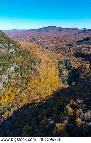 Panoramic View Of Late Fall Foliage In Smugglers Notch, Vermont.