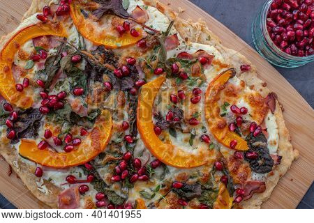 Tarte Flambee With Pumpkin, Cheese, Kale And Pomegranate