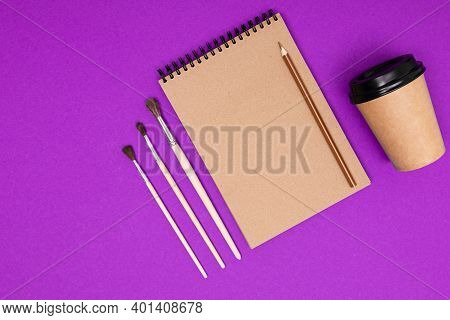 Drawing Set Sach As Brushes, Note, Scetchbook, Paints, Oil And Cup Of Coffee Isolated On Blue Backgr
