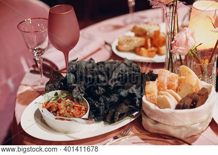 Waiter Serving Food For Presentation To The Client. Food Stylist Decor Black Food