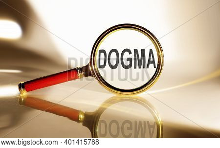 Dogma Concept. Magnifier Glass With Text On The White Background In Sunlight.