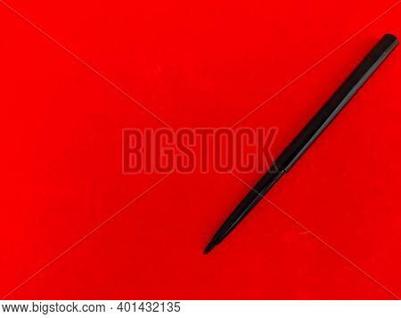 Copy Space Of Kajal Pencil Isolated On Red Background.