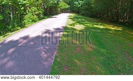 Paulding County, Ga Usa - 06 11 20: Paved Trail Side Ahead View In The Summer Silver Comet Trail Is 
