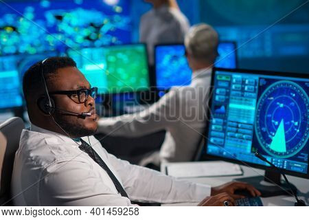 Workplace Of The Air Traffic Controllers In The Control Tower. Diverse Team Of Aircraft Control Offi