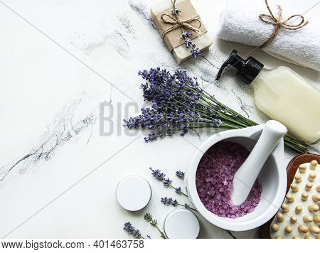 Flat Lay Composition With Lavender Flowers And Natural Cosmetic On Marble Background