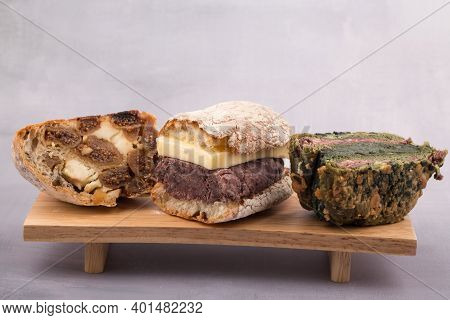 Korean Sweet Red Bean With Butter Bread And Fig Bread On A Wooden Board