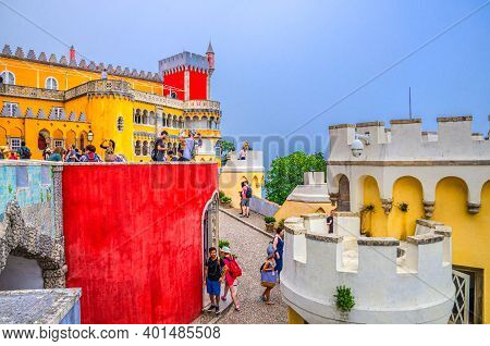 Sintra, Portugal, June 14, 2017: People Tourists In Pena Palace With Colorful Stone Walls And Merlon