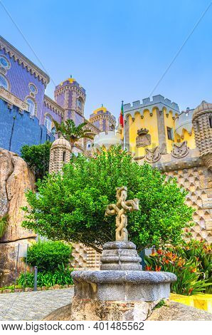 Sintra, Portugal, June 14, 2017: Pena Palace With Colorful Decorative Walls, Towers And Stone Cross,