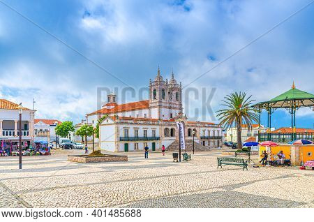 Nazare, Portugal, June 22, 2017: Sanctuary Of Our Lady Of Nazare Catholic Church And Street Misician