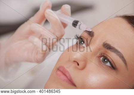 Close Up Cropped Shot Of A Beautiful Woman Getting Anti Aging Wrinkles Treatment At Beauty Clinic. P