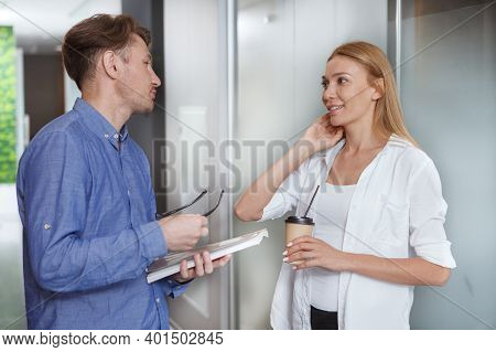 Beautiful Female Entrepreneur Chatting To A Colleague During Coffee Break