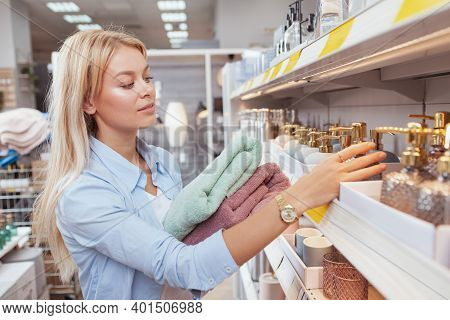 Gorgeous Woman Shopping Homeware At Hypermarket, Copy Space. Housewife Buying Home Goods